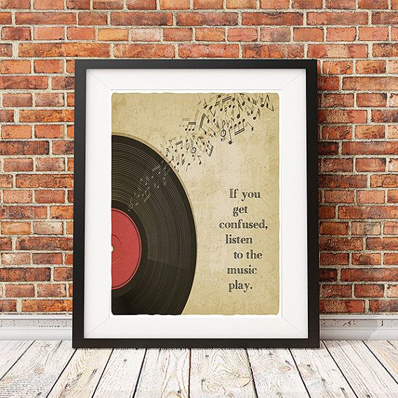 A 7-inch single cover showing Bob Dylan in front of a field. The words "Bob Dylan", "Watching The River Flow", and "Spanish Is The Loving Tongue" appear over the picture.